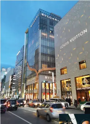  ??  ?? Above: Ginza’s main drag, Chuo-dori, is lined with the flagship stores of many high-end fashion brands. Right: Akihisa Nakamura, the fifth-generation owner of the Nakamura Katsuji letterpres­s workshop.