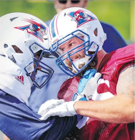  ?? JOHN MAHONEY ?? Pass rusher Gabriel Knapton, right, has come full circle in the CFL, returning to the Alouettes after being released by the Lions.