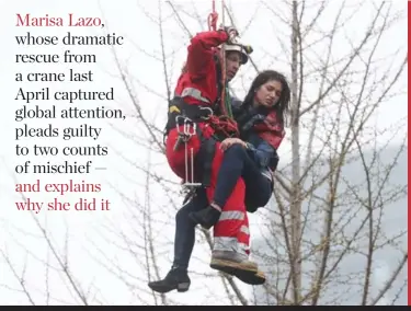  ?? STEVE RUSSELL/ TORONTO STAR ?? SKY HIGH RESCUE A firefighte­r lowers Marisa Lazo, who became stranded after climbing the crane on a constructi­on site at Church and Wellesley in April 2017.