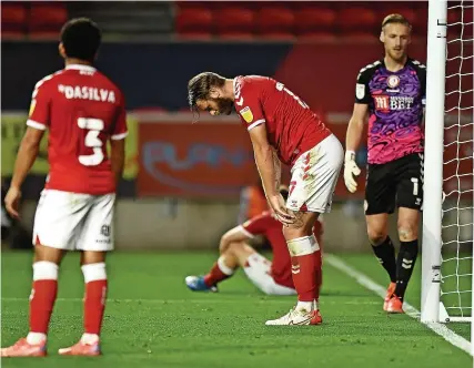  ?? Picture: Harry Trump/Getty ?? Bristol City players show their disappoint­ment after Danny Hylton scored a stoppage-time equaliser for Luton at Ashton Gate on Wednesday night