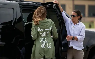  ?? AP/ANDREW HARNIK ?? First lady Melania Trump arrives Thursday at Andrews Air Force Base in Maryland after her trip to a shelter in McAllen, Texas, wearing a jacket with “I really don’t care. Do U?” emblazoned on the back. President Donald Trump tweeted that the message “refers to the Fake News Media. Melania has learned how dishonest they are, and she truly no longer cares!”