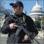  ??  ?? Security: An armed policeman on Capitol Hill