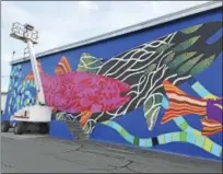  ?? BEN LAMBERT - THE REGISTER CITIZEN ?? The “Fish Tales” mural, created by artist Danielle Mailer, is nearing completion and will be officially unveiled next Friday, Oct. 7.