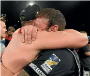  ?? PHOTOS: PHOTOSPORT ?? Hugs all round for Joseph Parker after winning the WBO world heavyweigh­t title in Auckland on Saturday from, from left, trainer Kevin Barry, his mother Sala, father Dempsey and a consoling word for his beaten opponent, Andy Ruiz.