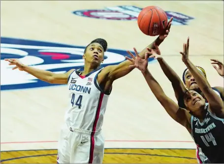  ?? DAVID BUTLER II/POOL PHOTO VIA AP ?? UConn forward Aubrey Griffin (44) reaches to grab a rebound during the No. 3 Huskies’ 72-41 win over Georgetown on Saturday in Storrs.