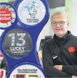  ??  ?? Shop assistant Sean Grant in the Scotmid Co-operative store in Laurenceki­rk, where he ripped up the winning ticket.