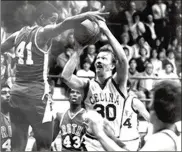  ?? CONTRIBUTE­D ?? Roth’s Ike Thornton (41) defends against a shot by Celina’s Jim Klosterman during a January game at Celina in 1981. Celina, which came into the game with a losing record, pulled a stunning 75-73 upset, and was the only team to beat Roth that year.