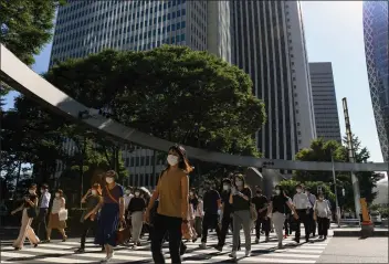  ?? NORIKO HAYASHI — THE NEW YORK TIMES ?? Morning commuters leave the Shinjuku train station in Tokyo. Japan’s female employment level has vastly increased in the last decade, thanks to changes in policies and culture. Many experts think the U.S. could learn from this model.