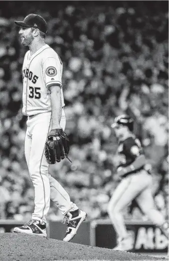  ?? Karen Warren / Staff photograph­er ?? Justin Verlander reacts after allowing a home run to Juan Soto during the fifth inning of Game 6. Verlander was charged with the loss after giving up three runs on five hits in five innings.