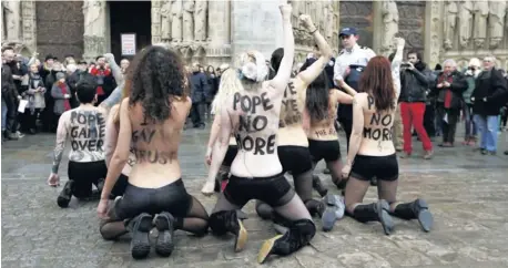  ?? Picture: REUTERS ?? GETTING IT OFF THEIR CHESTS: Femen activists protest outside Notre Dame cathedral in Paris last month. The protest was organised to celebrate the resignatio­n of Pope Benedict XVI and the French parliament s decision to approve a draft law allowing...