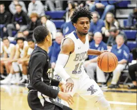  ?? MARC PENDLETON / STAFF ?? Xenia senior Samari Curtis was coming off his season-low output, 19 points, against Fairmont before striking for a school-record 52 in a 90-55 defeat of Bellefonta­ine on Tuesday.