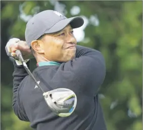  ?? JOHN MINCHILLO ?? Tiger Woods watches his shot off the 12th tee during practice before the U.S. Open Championsh­ip golf tournament at Winged Foot Golf Club, Tuesday, Sept. 15, 2020, in Mamaroneck, N.Y.