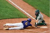  ?? DAVID JABLONSKI / STAFF ?? Badin catcher Jimmy Nugent, one of the 2022 Johnny Bench Award winners, tags out Bloom-carroll’s Evan Dozer in a Division II state semifinal earlier this month in Akron.