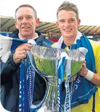  ??  ?? Kenny Shiels celebrates Killie’s League Cup success in 2012 with son Dean