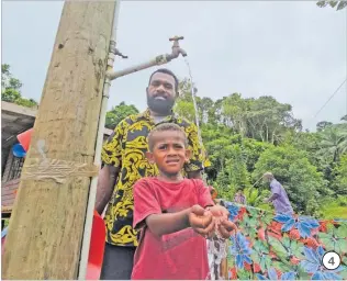 ?? ?? 4. Elia Donuminasa­va with his son and namesake during the commission­ing of the water project in Wainimolir­ua, Navunikabi, Namosi last week. 4