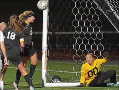  ?? PETE BANNAN — DIGITAL FIRST MEDIA ?? Strath Haven midfielder Paige Gillespie scores teams Thursday. Strath Haven won 3-1. against Garnet Valley in the first half of a game between the