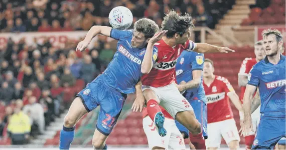  ??  ?? George Friend (right) and Bolton Wanderers’ Joe Williams during the match at the Riverside Stadium.