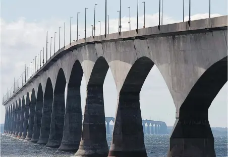  ??  ?? The Confederat­ion Bridge viewed from Borden-Carleton, P.E.I. The province has been closed to all non-essential travellers since April 17 and only began allowing seasonal residents to come from within Canada on June 1.