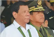  ?? (AFP) ?? Philippine President Rodrigo Duterte (left) during a ceremony at Fort Bonifacio in Manila on October 5