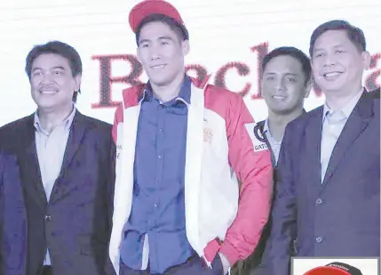  ?? BOB DUNGO JR. ?? Far Eastern University standout Mac Belo (center) with Blackwater officials during the PBA Special Draft for Gilas Pilipinas members. Blackwater also picks Raphael Banal of Racal Tile Masters in the Regular Draft.