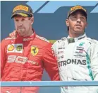  ?? RYAN REMIORZ/THE CANADIAN PRESS VIA AP ?? Lewis Hamilton, right, consoles Sebastian Vettel after Hamilton won the Formula One Canadian Grand Prix.