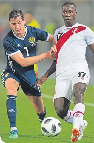  ??  ?? Kenny Mclean up against Luis Advincula of Peru in Lima back in May