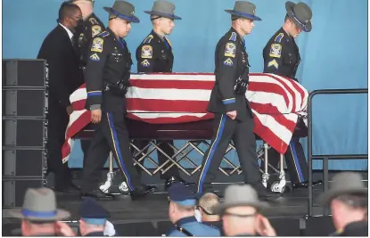  ?? Brian A. Pounds / Hearst Connecticu­t Media ?? State troopers carry the casket of Sgt. Brian Mohl during his funeral service Thursday at the Xfinity Theatre in Hartford.