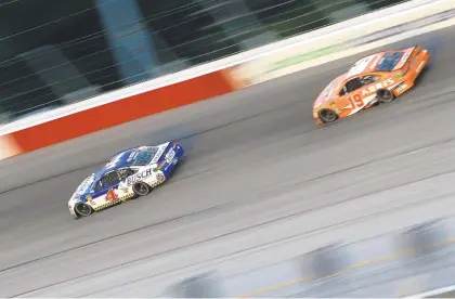  ?? GETTY IMAGES FILE ?? Kevin Harvick, who won the regular-season race at Las Vegas Motor Speedway, leads Daniel Suarez on Sept. 2 at Darlington Raceway.