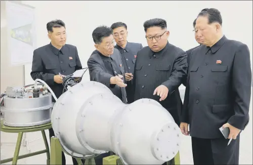  ?? PICTURE: KOREAN CENTRAL NEWS AGENCY. ?? DANGER: A propaganda image issued yesterday showing Kim Jong Un inspected the loading of a hydrogen bomb into a new interconti­nental ballistic missile.