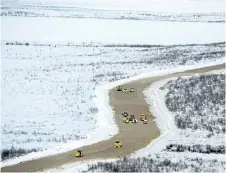  ?? JAMES MACKENZIE HANDOUT/THE CANADIAN PRESS ?? Constructi­on on Inuvik Tuktoyaktu­k highway in Inuvik, N.W.T., is shown in this undated handout photo. The new 120-kilometre all-weather gravel road, which opens Wednesday, is Canada’s first land link to its Arctic coast.