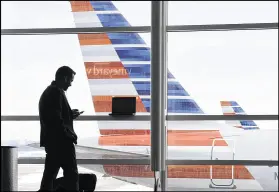  ?? SUSAN WALSH / AP FILE ?? Consumers have until Monday to submit comments to the U.S. Department of Transporta­tion about whether airline passengers should make cellphone calls while in the air.