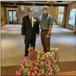  ?? SUBMITTED PHOTO ?? Paul Rosen, left, general manager of Plush Mills and Brendon Hughes, maintenanc­e team member of Plush Mills, stand with the tulips that would be planted at Plush Mills. The owner of Plush Mills bought a truck load of flowers to help a local farmer who had prepared them to sell for Easter but was unable to sell because of the current quarantine situation.