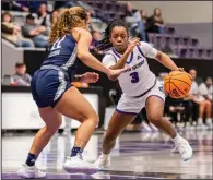  ?? (Photo courtesy UCA Athletics) ?? Central Arkansas guard Randrea Wright (3) tries to dribble around North Florida guard Lyric Swann on Saturday during the Sugar Bears’ 58-44 victory over the Ospreys in Conway.