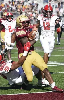  ?? HERALD STAFF FILE; bELoW, STuART CAHILL / HERALD STAFF FILE ?? TIME TO SHINE: BC’s David Bailey scores a touchdown last season against NC State. The Eagles open the 2020 season at Duke this afternoon. Below, Bailey splits a pair of defenders during a run again against Kansas last year.