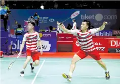  ?? — Reuters photo ?? Indonesia double player badminton Marcus Fernaldi Gideon (right) and Kevin Sanjaya Sukamuljo plays against Denmark’s player during Indonesia Open championsh­ip in Jakarta, Indonesia in this July 6 file photo.