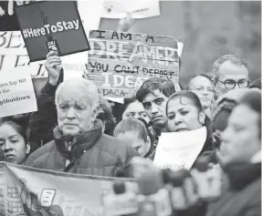  ?? SPENCER PLATT/GETTY IMAGES ?? Demonstrat­ors protest the government shutdown and the lack of a deal on immigratio­n Monday in New York City.