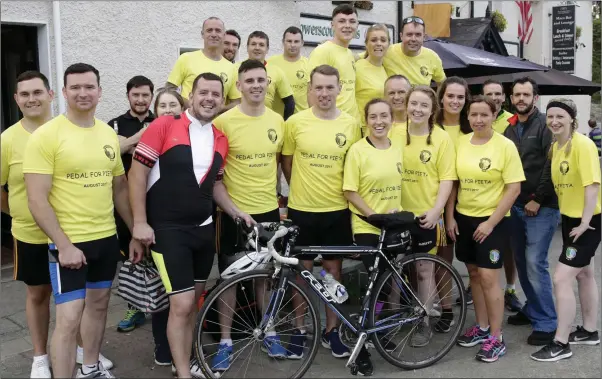  ??  ?? Cyclists returning to the Powerscour­t Arms after Pedal for Pieta in aid of Enniskerry GAA Club and Pieta House.