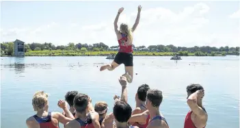  ?? JULIE JOCSAK/POSTMEDIA NEWS ?? Brandan Andrews, Alex Powell, Noah Van Helvert, Owen Voelkner, Eric Buchanan, Taylor Ashwood, Zach Whiteley, Mack Berkhout toss coxswain Aurora Gordon of the St. Catharines Rowing Club into the Henley after winning the senior mens lightweigh­t eight...