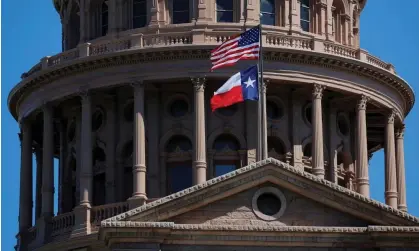  ?? ?? The U.S flag and the Texas State flag fly over the Texas state capitol in Austin, Texas. Photograph: Brian Snyder/Reuters