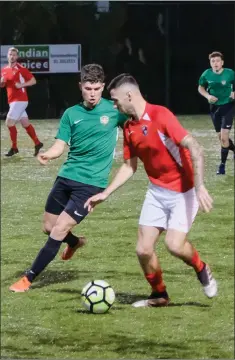  ??  ?? Michael O’Brien of Greystones United closes in on Robbie McCourt of Tolka Rovers.