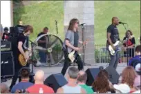  ?? JONATHAN TRESSLER — THE NEWS-HERALD ?? Soul Asylum rocks the crowd during the new Mentor amphitheat­er’s grand opening July 4 before the fireworks.