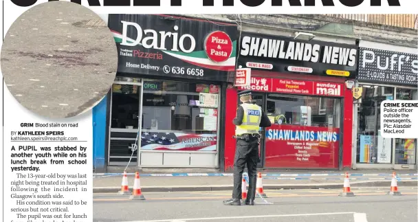  ??  ?? GRIM Blood stain on road CRIME SCENE Police officer outside the newsagents. Pic: Alasdair MacLeod