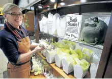  ?? CLIFFORD SKARSTEDT/EXAMINER ?? Simple Soap Shoppe owner Alex Fitzgerald at her holiday bath bomb hut on Thursday at Peterborou­gh Square. The Nov. 15 fire on the roof of 370374 George St. damaged the building housing Simple and Ash Nayler Photograph­y on the second floor.
