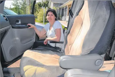  ?? ERIC MCCARTHY/JOURNAL PIONEER ?? It’s a long way up from Lisa Doucette’s wheelchair to the passenger seat of her family’s van. A committee is trying to raise the money to buy her a wheelchair accessible van.