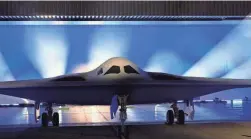  ?? MARCIO JOSE SANCHEZ/AP ?? The B-21 Raider stealth bomber is unveiled at Northrop Grumman on Friday in Palmdale, Calif. America’s newest nuclear stealth bomber was developed as part of the Pentagon’s answer to rising concerns over a future conflict with China.