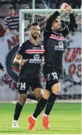  ?? (Eran Luf) ?? BNEI SAKHNIN midfielder Nir Lax (right) celebrates after scoring the winner in last night’s 1-0 victory over Maccabi Petah Tikva at Doha Stadium.