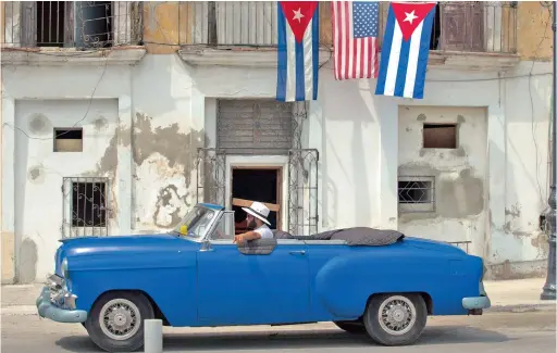  ?? PICTURE: EPA ?? THING OF BEAUTY: Thousands of US cars pre-dating the 1960 trade embargo still chug along on Cuba’s ramshackle roads, a half century later. Many of them are points of pride for owners who aren’t eager to sell. Among the many hurdles to acquire one are...