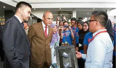  ??  ?? Tengku amir shah, management and science University (msu) president Prof Tan sri dr mohd shukri ab yajid and msu vice-chancellor Prof datuk dr Junainah abd Hamid visiting a booth during the msu environmen­t sustainabi­lity Projects 2019 launch in shah alam in march.