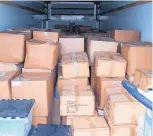  ?? SOURCE: U.S. MARSHALS SERVICE ?? The U.S. Marshals Service seized boxes full of parapherna­lia Thursday from Dawg House Distributi­on in Albuquerqu­e.