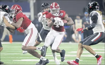  ?? MICHAEL AINSWORTH — THE ASSOCIATED PRESS ?? Running back Brian Robinson Jr. (4) of No. 1 Alabama runs for a first down as No. 4 Cincinnati’s Deshawn Pace reaches from behind to tackle him during the CFP semifnal Cotton Bowl game on Friday in Arlington, Texas. Alabama won 27-6.